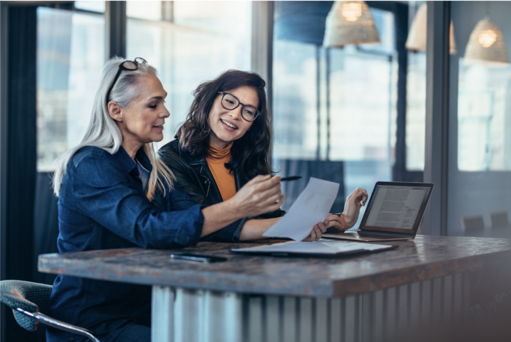 Two women at a desk not having an awkward conversation