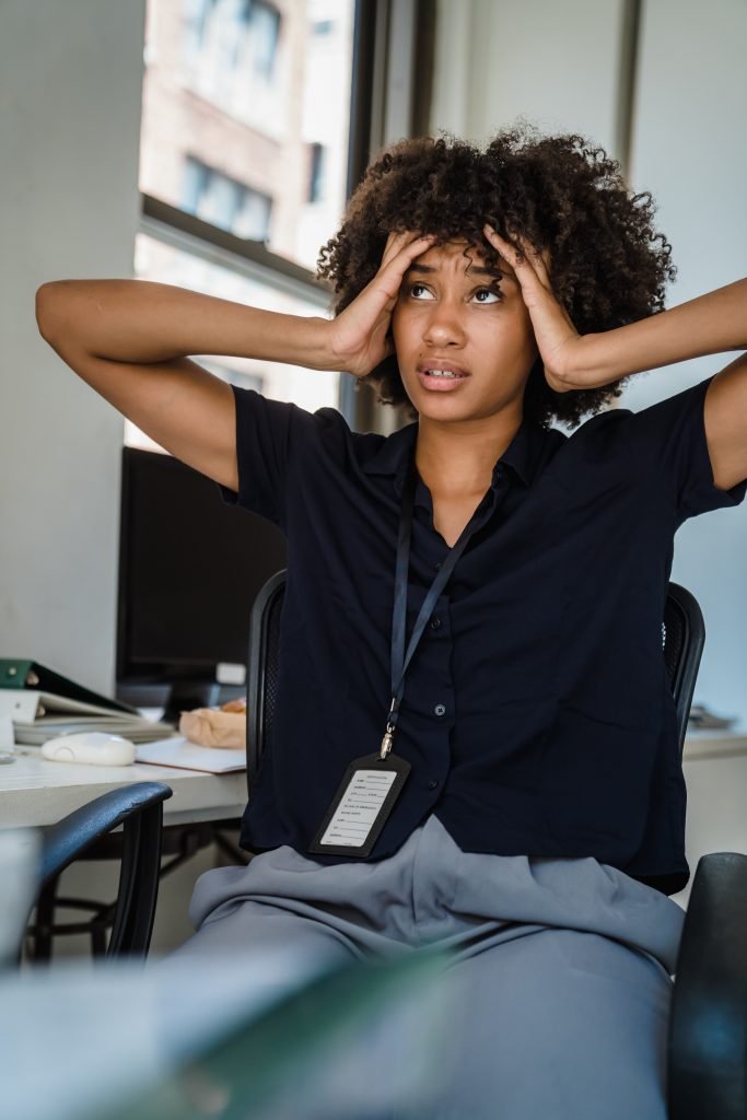 A woman looking thoughtful - representing that she is about to have an awkward conversation